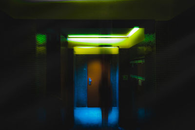 Blurred image of person in illuminated room