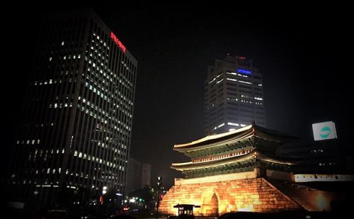 Low angle view of modern building at night