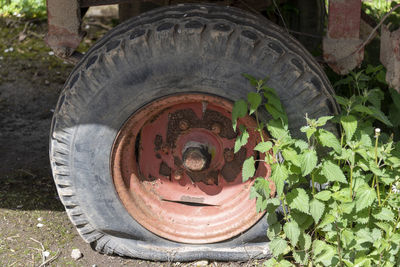 Close-up of old abandoned truck on field