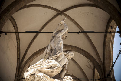 Low angle view of statues at loggia dei lanzi