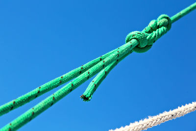 Close-up of rope against blue sky