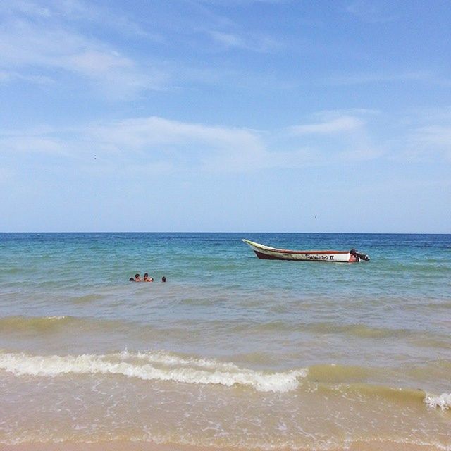 sea, water, horizon over water, nautical vessel, sky, beach, transportation, boat, mode of transport, scenics, beauty in nature, nature, shore, tranquility, tranquil scene, leisure activity, wave, vacations, men