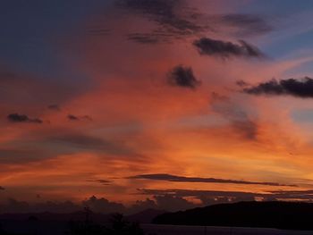 Low angle view of dramatic sky during sunset