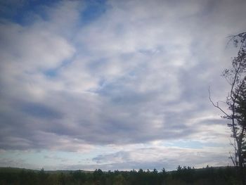 Scenic view of landscape against cloudy sky