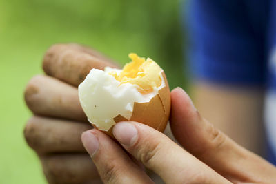 Close-up of hand holding ice cream