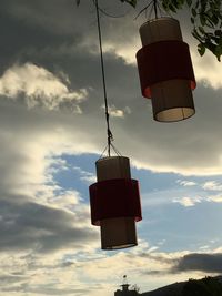 Low angle view of lantern against sky