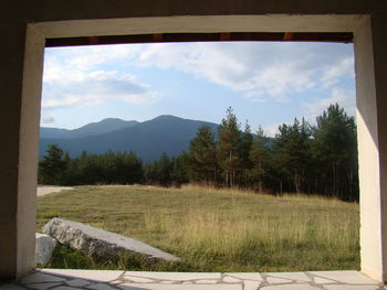 Scenic view of farm against sky