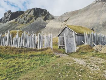 Built structure on land against sky