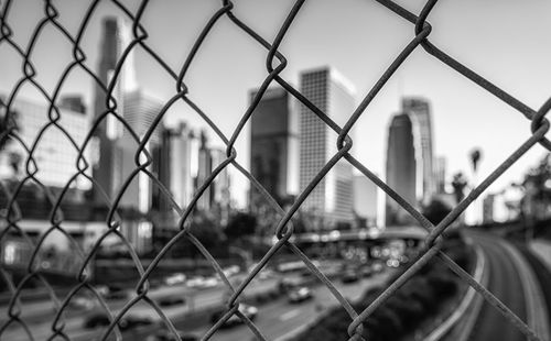 Close-up of chainlink fence against sky