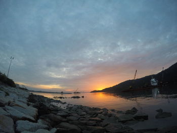 Scenic view of sea against sky at sunset