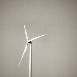 Wind turbine against sky