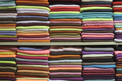 Stack of fabric on shelf at shop