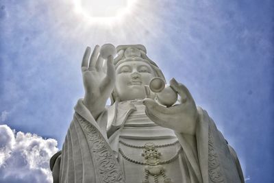 Low angle view of statue against sky