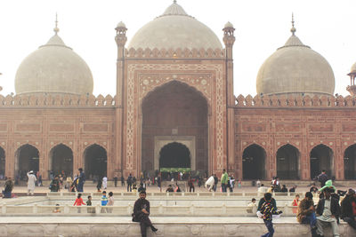 Group of people in front of historical building