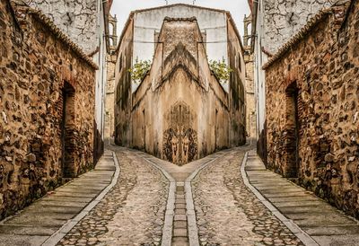 Walkway leading to brick wall