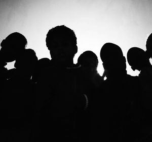 Silhouette of woman in dark background