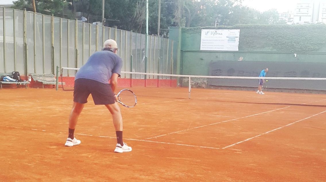 FULL LENGTH OF A MAN PLAYING WITH BALL IN BACKGROUND