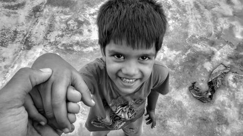 High angle portrait of boy standing on land