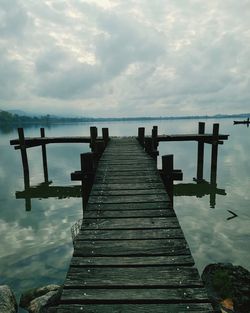 Pier over sea against sky