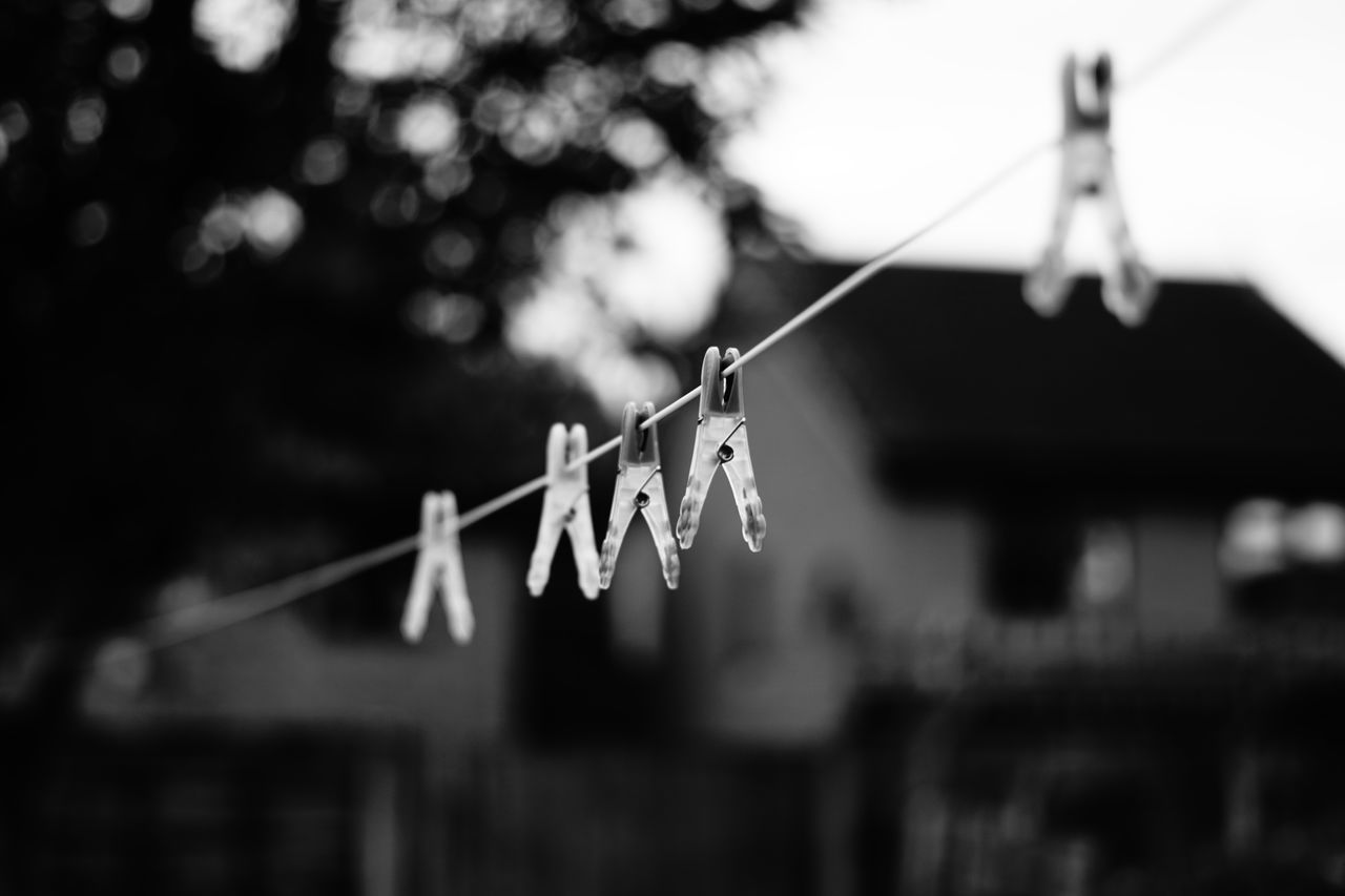 CLOSE-UP OF CLOTHESPINS ON CLOTHESLINE