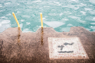 High angle view of text written on swimming pool