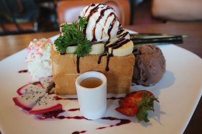 Close-up of cake served in plate on table