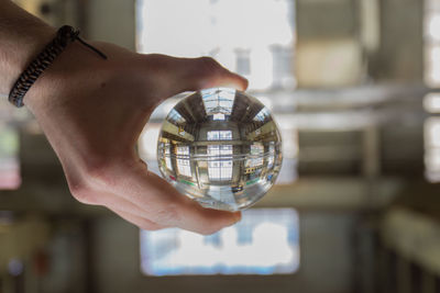 Close-up of hand holding camera