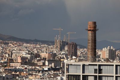 Buildings in city against sky