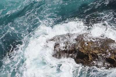 Waves splashing on rocks