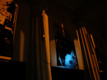 Low angle view of illuminated window at home
