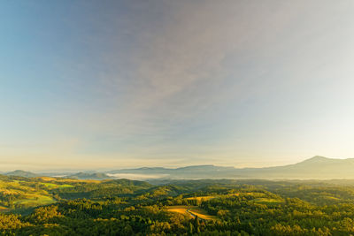 Scenic view of landscape against sky during sunrise