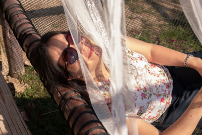 Portrait of young woman wearing sunglasses