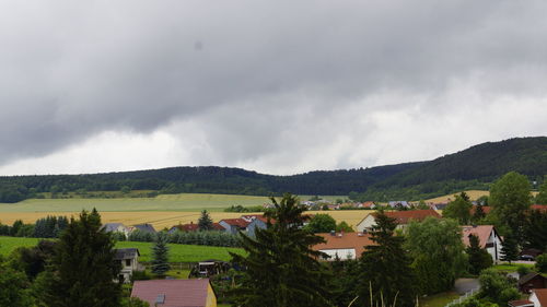 Scenic view of mountains against cloudy sky