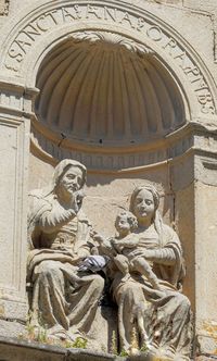 Low angle view of statue against building