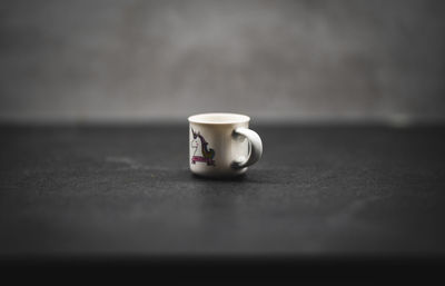 Close-up of coffee cup on table