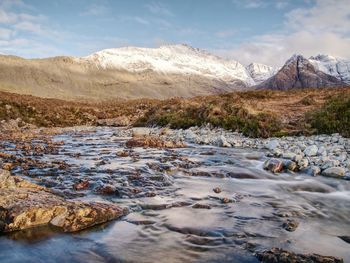 Scenic view of snowcapped mountains against sky