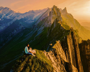 Rear view of man standing on mountain