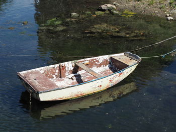 High angle view of abandoned boat floating on lake