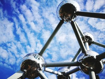 Low angle view of bicycle wheel against sky