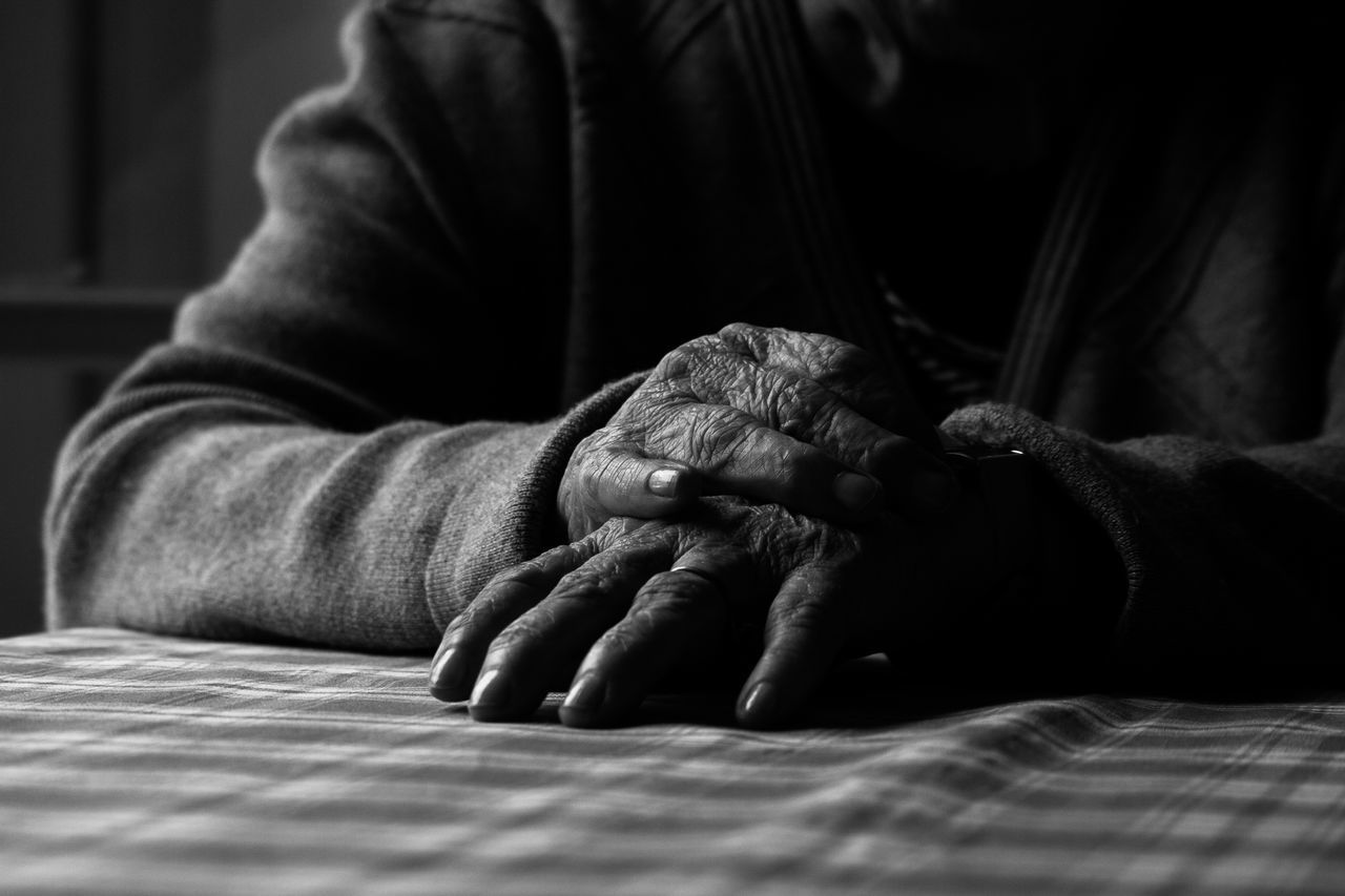 indoors, men, relaxation, bed, selective focus, home interior, sleeping, close-up, lifestyles, sitting, midsection, focus on foreground, person, resting, casual clothing, part of, bedroom