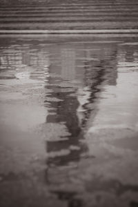 High angle view of wet puddle on street