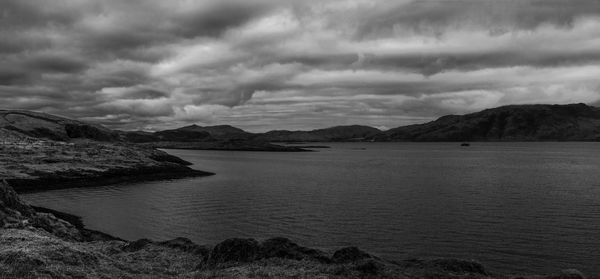 Scenic view of sea against dramatic sky