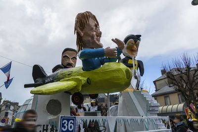 Low angle view of statues against sky