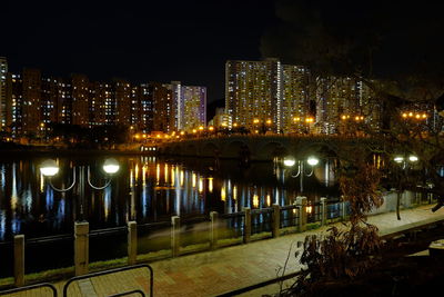 High angle view of illuminated buildings in city at night