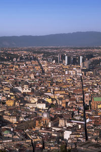 Aerial view of townscape against clear sky