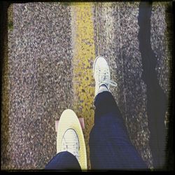 Low section of woman standing on tiled floor