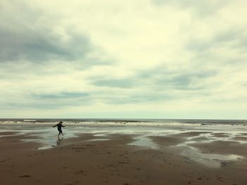 Scenic view of beach against sky