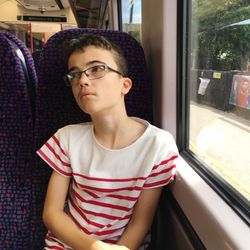 Boy sitting in train