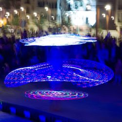 Close-up of illuminated christmas lights in city at night