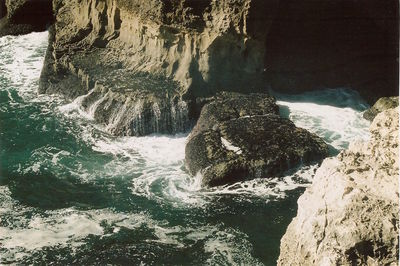 Scenic view of river flowing through rocks